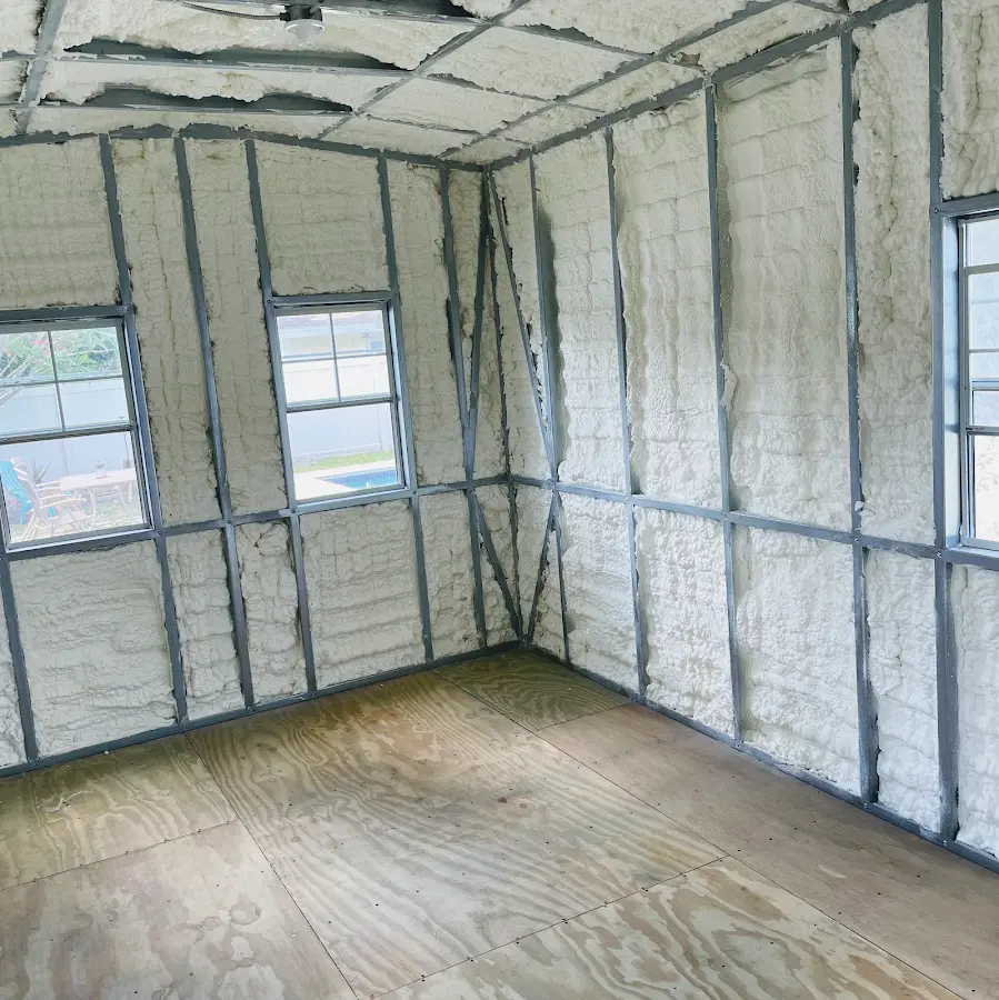 Closed-cell spray foam insulation applied to wall cavities in a residential project in Florence